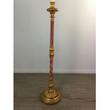 A MOULDED GILTWOOD AND CRIMSON DAMASK MOUNTED FLOOR LAMP