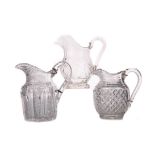 A COLLECTION OF THREE EARLY 19TH CENTURY CUT GLASS JUGS