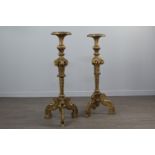 A PAIR OF 19TH CENTURY BAROQUE STYLE GILTWOOD TORCHERES
