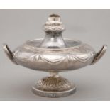 A VICTORIAN SILVER PATENT CIGAR LAMP, OF COMPRESSED FORM WITH REEDED HANDLES AND EMBOSSED WITH