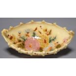 A ZSOLNAY BOAT SHAPED DISH, C1890, DECORATED WITH FLOWERS IN GILT RIM, 27.5CM L, IMPRESSED ZSOLNAY