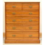 A SATIN BIRCH CHEST OF DRAWERS, C1880, WITH PIERCED BRASS HANDLES, THE SIDES PANELLED, 143CM H;