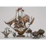 A SPANISH GILT SILVER COLOURED FILIGREE AND ENAMEL MODEL OF A SHIP AND FIVE SIMILAR SMALLER