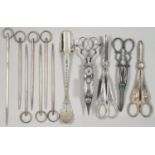 A PAIR OF CLOSE PLATED WICK TRIMMERS, THREE PAIRS OF EPNS GRAPE SHEARS, CHEESE SCOOP AND SET OF