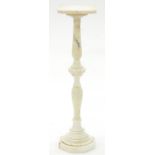 A MARBLE TORCHERE, 20TH C, 91CM H Two hairline cracks to base, light scratches to top surface