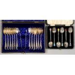 A SET OF TWELVE EDWARDIAN SILVER COFFEE SPOONS AND PAIR OF SUGAR BOWS, ENGRAVED WITH FLOWERS,