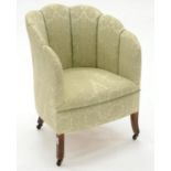 A PALE GREEN BROCADE SHELL BACK TUB CHAIR, C1930, SEAT HEIGHT 40CM, WIDTH 56CM Solid on legs and