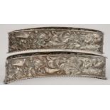A PAIR OF VICTORIAN SILVER CRESCENT SHAPED FLOWER HOLDERS, STAMPED IN HIGH RELIEF WITH GROTESQUES,