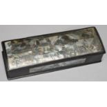 A SOUTH EAST ASIAN MOTHER OF PEARL AND ABALONE INLAID AND EBONISED WOOD GLOVE BOX AND COVER,