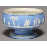 A WEDGWOOD BLUE JASPER DIP FOOTED BOWL, LATE 19TH C, SPRIGGED WITH A CONTINUOUS SCENE OF CLASSICAL