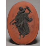 A WEDGWOOD BASALT OVAL PLAQUE OF A NYMPH WITH CYMBALS, ALTERNATIVE TITLE HERCULANEUM NYMPH WITH