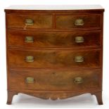 A VICTORIAN BOW FRONTED MAHOGANY CHEST OF DRAWERS, CROSSBANDED IN SATINWOOD AND LINE INLAID, ON