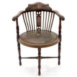 AN EDWARDIAN MAHOGANY AND INLAID SALON CHAIR, C1900, WITH CLOSE NAILED, PADDED OVAL SEAT, ON
