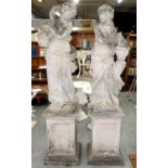 A PAIR OF HALF LIFE SIZED RECONSTITUTED STONE  GARDEN STATUES OF YOUNG WOMEN EMBLEMATIC OF SUMMER