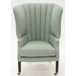 A GEORGE III WINGBACK CHAIR, ON MOULDED MAHOGANY FORELEGS AND CASTORS, RECENT COLEFAX AND FOWLER