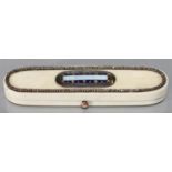 A GEORGE III IVORY TOOTHPICK BOX, C1790,THE LID WITH A BLUE AND GILT BORDERED SEMI OPALESCENT