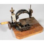 A WILCOX & GIBBS SEWING MACHINE LATE 19TH C, 22CM H EXCLUDING LATER WOOD BASE Heavily encrusted with