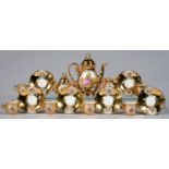 A GERMAN GILT GROUND COFFEE SERVICE, CIRCA MID 20TH C, PRINTED AND PAINTED WITH 18TH C LOVERS,