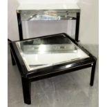 A STYLISH MIRROR GLASS AND BLACK PAINTED WOOD SIDE TABLE, 82CM H; 101 X 38CM AND A SIMILAR COFFEE