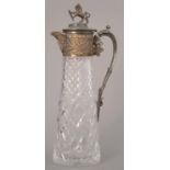 A VICTORIAN EPNS MOUNTED CUT GLASS CLARET JUG, C1890 WITH LION FINIAL, 32CM H Plating worn,