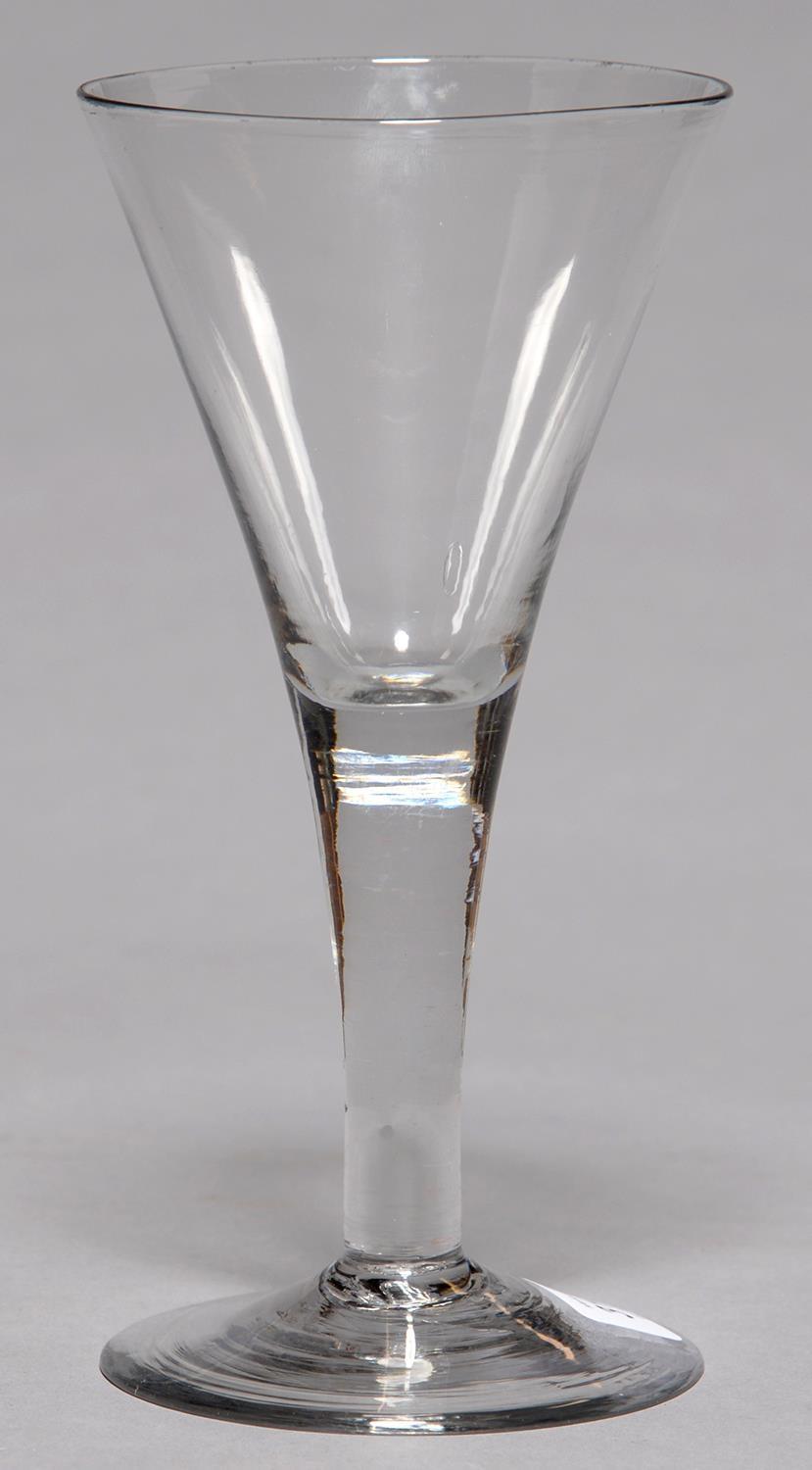 AN ENGLISH GLASS GOBLET, C1770, THE FLARED BOWL ON SOLID STEM AND SPREADING FOOT WITH SHARP PONTIL