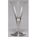 AN ENGLISH GLASS GOBLET, C1770, THE FLARED BOWL ON SOLID STEM AND SPREADING FOOT WITH SHARP PONTIL