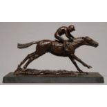 A BRONZE RESIN SCULPTURE OF A RACEHORSE WITH JOCKEY UP, LATE 20TH C, ON SLATE BASE, 35CM L Good