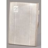 A SILVER CIGARETTE CASE, ENGINE TURNED, 8.5 X 12.4CM, BY E J HOULSTON, BIRMINGHAM 1946, 6 OZ 13