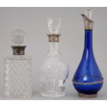 AN ELIZABETH II SILVER  MOUNTED BLUE GLASS DECANTER AND STOPPER, 32CM H, MAKER VRL, 2002 AND A