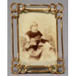 A GILT BRASS CHAIN PATTERN PHOTOGRAPH FRAME, C1900, ROD STRUT, 19.5CM H Good condition