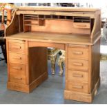 A BLEACHED OAK ROLL TOP DESK, 20TH C, 117CM H; 122 X 69CM Some minor staining inside, chip and