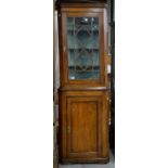 A GEORGE III OAK STANDING CORNER CUPBOARD, EARLY 19TH C, THE LOWER PART WITH PANELLED DOOR, 205CM H;