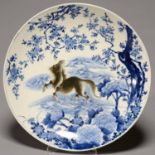 A JAPANESE BLUE AND WHITE AND SEPIA IMARI CHARGER, EARLY 20TH C, PAINTED WITH A WILD HORSE BENEATH A