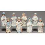 A GROUP OF EIGHT GERMAN PORCELAIN NODDING FIGURES OF MEN AND WOMEN, C1880, SIMILARLY DECORATED IN
