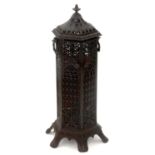 A DECORATIVE VICTORIAN HEXAGONAL CAST IRON STOVE, LATE 19TH C, WITH SWEPT COVER, SWING HANDLES AND