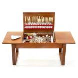A TEAK CANTEEN IN THE FORM OF A LOW TABLE, C1970, CONTAINING A CONTEMPORARY EPNS TABLE SERVICE, ETC,