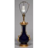 A FRENCH GILT BRASS MOUNTED BLUE GLAZED PORCELAIN VASE SHAPED LAMP, 20TH C, IN LOUIS XVI STYLE, ON