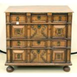 A WALNUT AND OAK GEOMETRIC MOULDED CHEST OF DRAWERS, LATE 19TH / EARLY 20TH C, IN WILLIAM III STYLE,