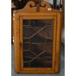 A FRUITWOOD AND OAK HANGING CORNER CABINET, 19TH C AND LATER, WITH SWAN NECK PEDIMENT, 103CM H; 31 X