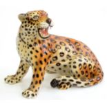 A DECORATIVE EARTHENWARE MODEL OF A LEOPARD, 20TH C, 48CM H; 55 X 38CM Overall in good clean