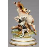 A CONTINENTAL PORCELAIN MODEL OF THE DEATH OF THE STAG, 20TH C, IN COLOURS ON ROUND GILT BADSE, 32CM