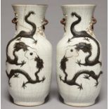 A PAIR OF CHINESE CRACKLE GLAZED DRAGON VASES, EARLY 20TH C, 45CM H One broken and restuck