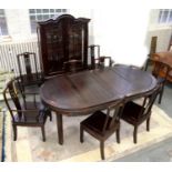A CHINESE CARVED HARDWOOD DINING TABLE, A SET OF EIGHT DINING CHAIRS, INCLUDING A PAIR OF ELBOW