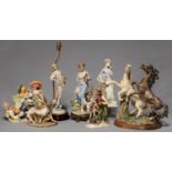 SEVEN VARIOUS CAPO DI MONTE AND OTHER CONTINENTAL PORCELAIN AND RESIN FIGURES, TO INCLUDE A GROUP OF