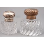 A SILVER MOUNTED CUT GLASS INKWELL AND A SIMILAR CONTEMPORARY FRENCH SILVER MOUNTED CUT GLASS BOTTLE