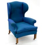 A MAHOGANY WING ARMCHAIR IN GEORGE III STYLE, EARLY 20TH C, WITH CONCAVE SEAT, ON SQUARE LEGS AND