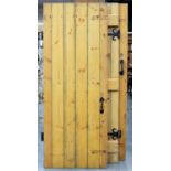 THREE BRACED PINE DOORS WITH BLACK PAINTED IRON FURNITURE, 195CM H X 75CM W Overall good clean