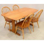AN ERCOL ASH TRESTLE ENDED DINING TABLE WITH OBLONG TOP, 74CM H; 80 X 152CM AND A SET OF FOUR