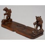 A SWISS ANTHROPOMORPHIC CARVED LIMEWOOD BEAR NOVELTY BOOK SLIDE, LATE 19TH / EARLY 19TH C, THE