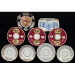 A SET OF THREE SPODE GADROONED CLARET GROUND DESSERT PLATES, 1822-33, PAINTED WITH LANDSCAPE